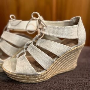Adorable tie up wedges. Gently used. These are tan with a hint of glimmer.